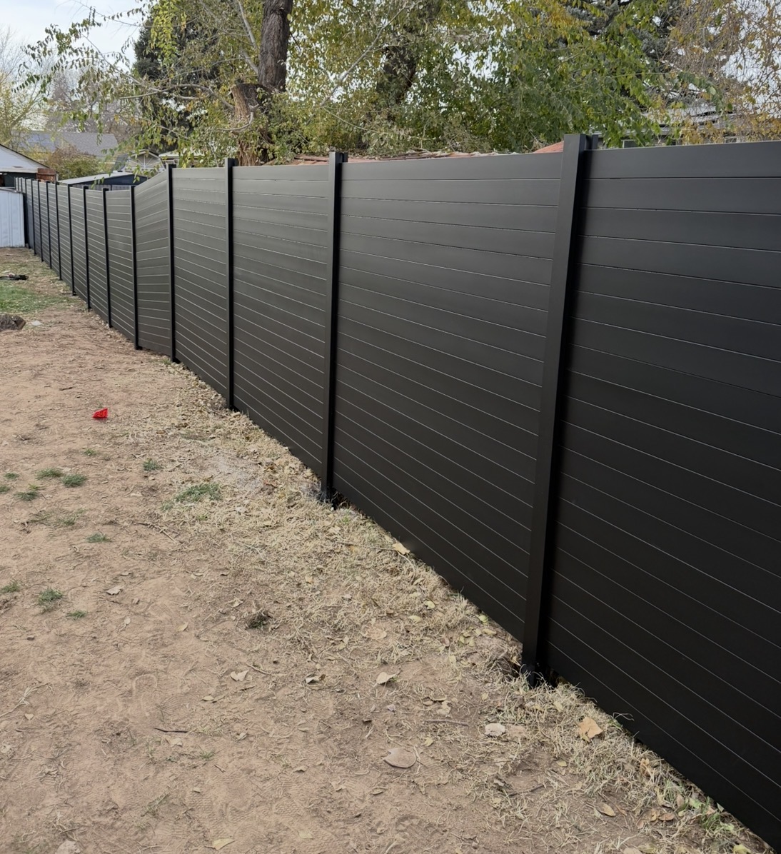 Full black Avimore aluminum privacy fence installed in Utah