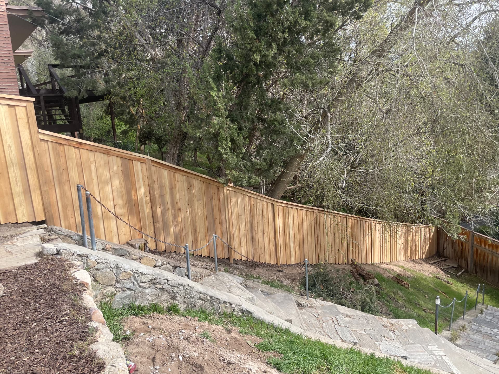 Cedar privacy fence on a hillside lot in Cottonwood Heights, Utah