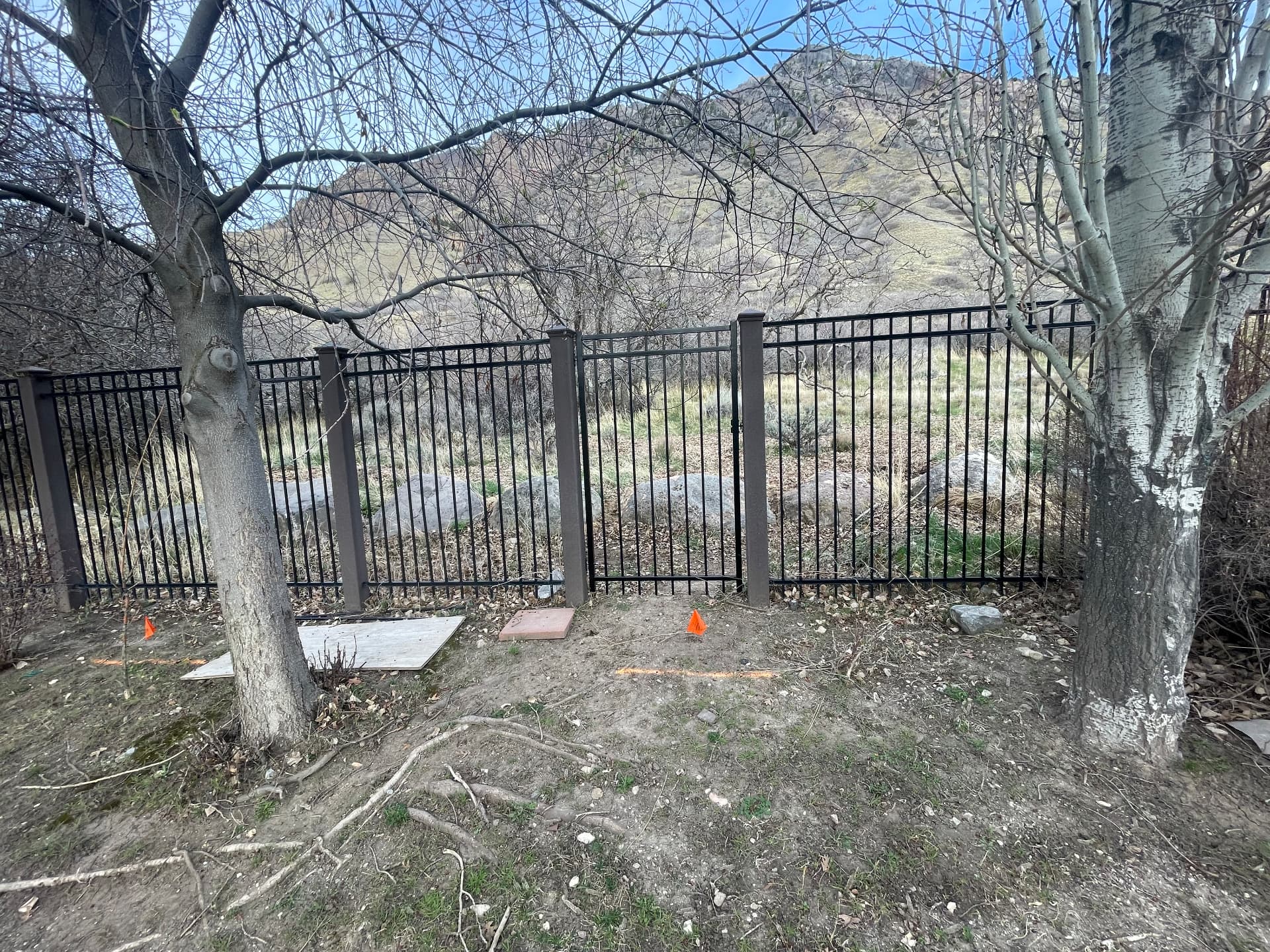 Black ornamental aluminum fence along a foothill property in Utah