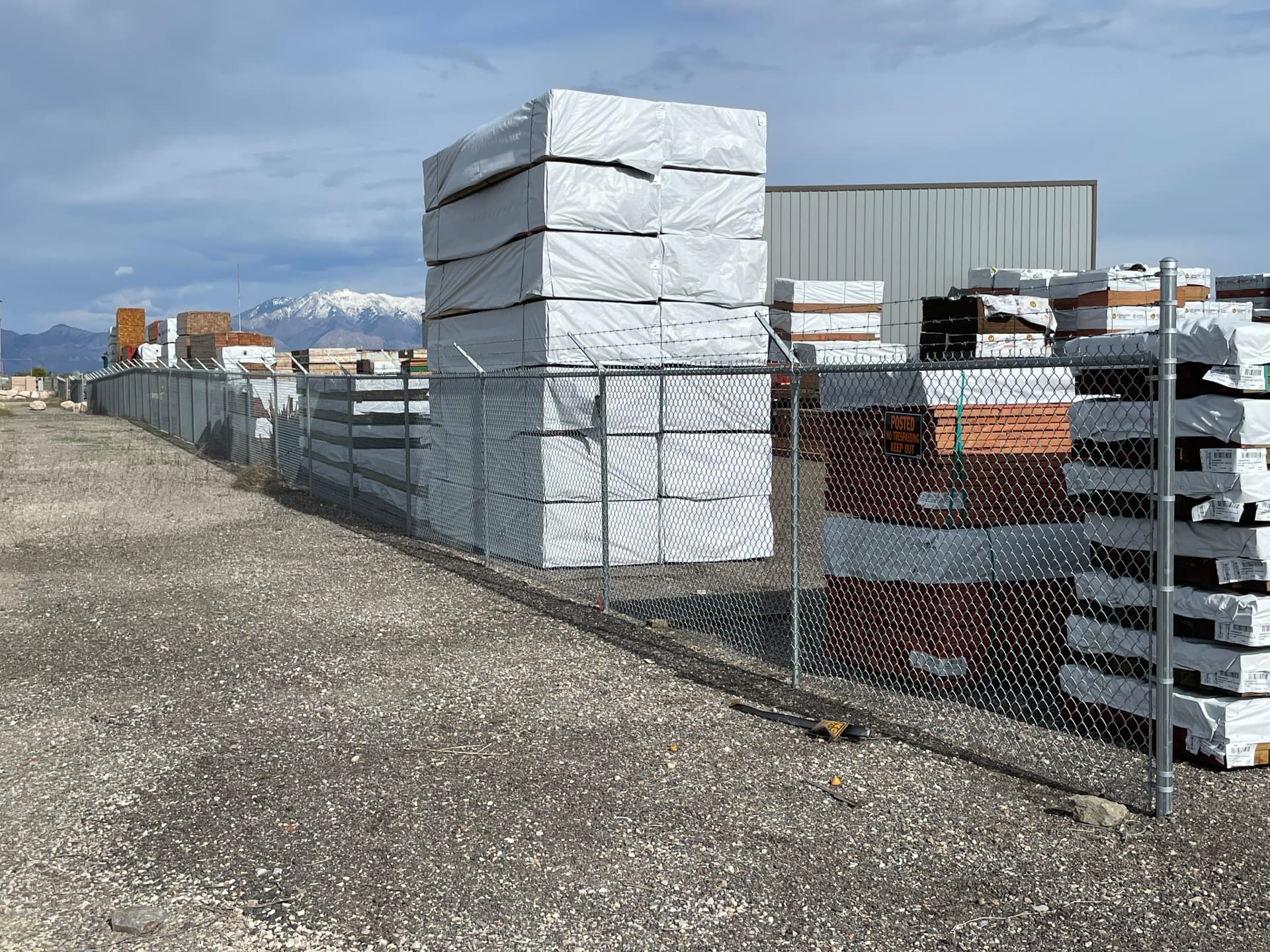 Commercial chain link security fence around a Utah lumber yard