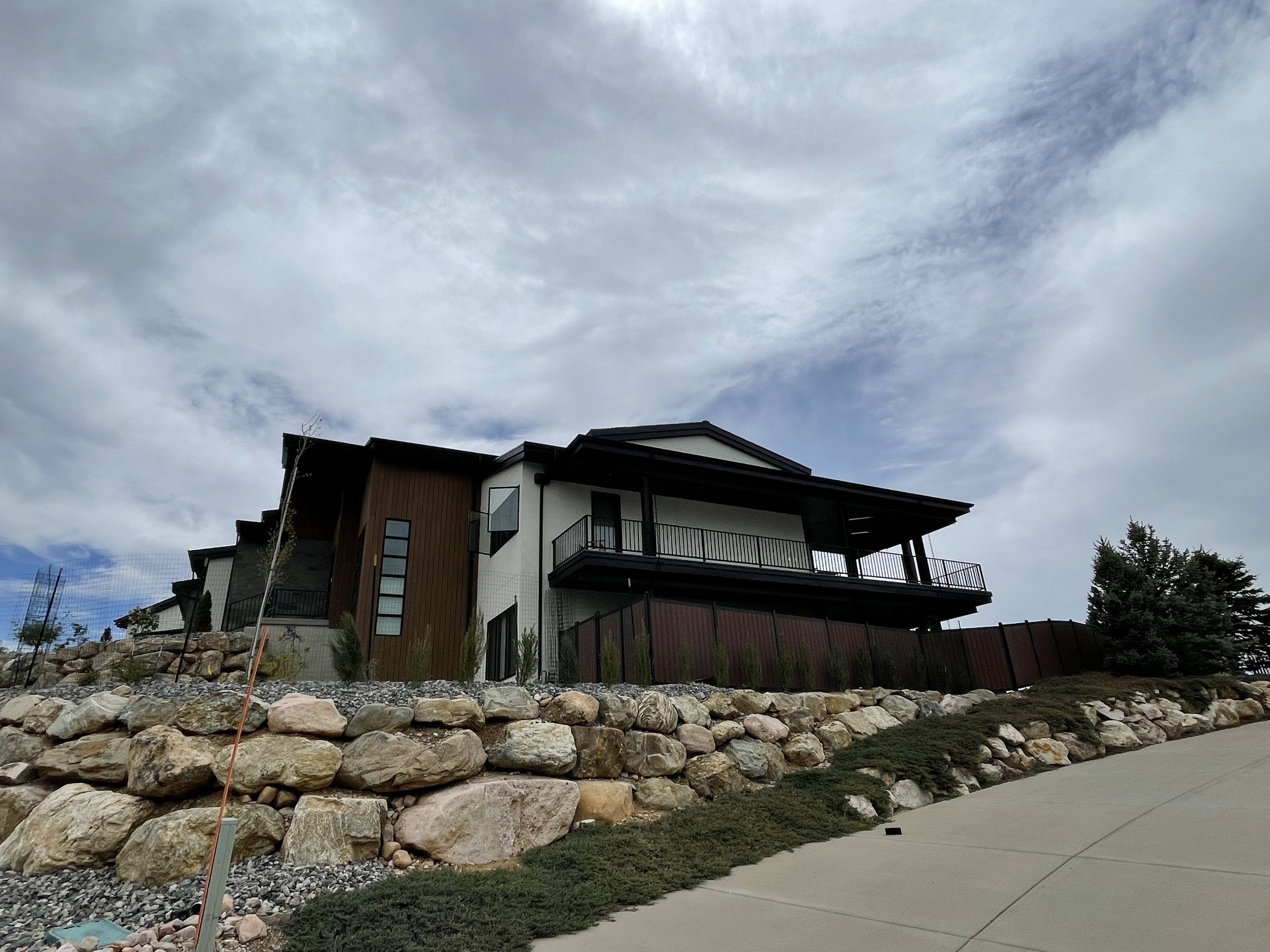 Black Avimore Aluminum with Composite Brown Wood Grain Fill installed by Spacemakers Fence in Bountiful, Utah