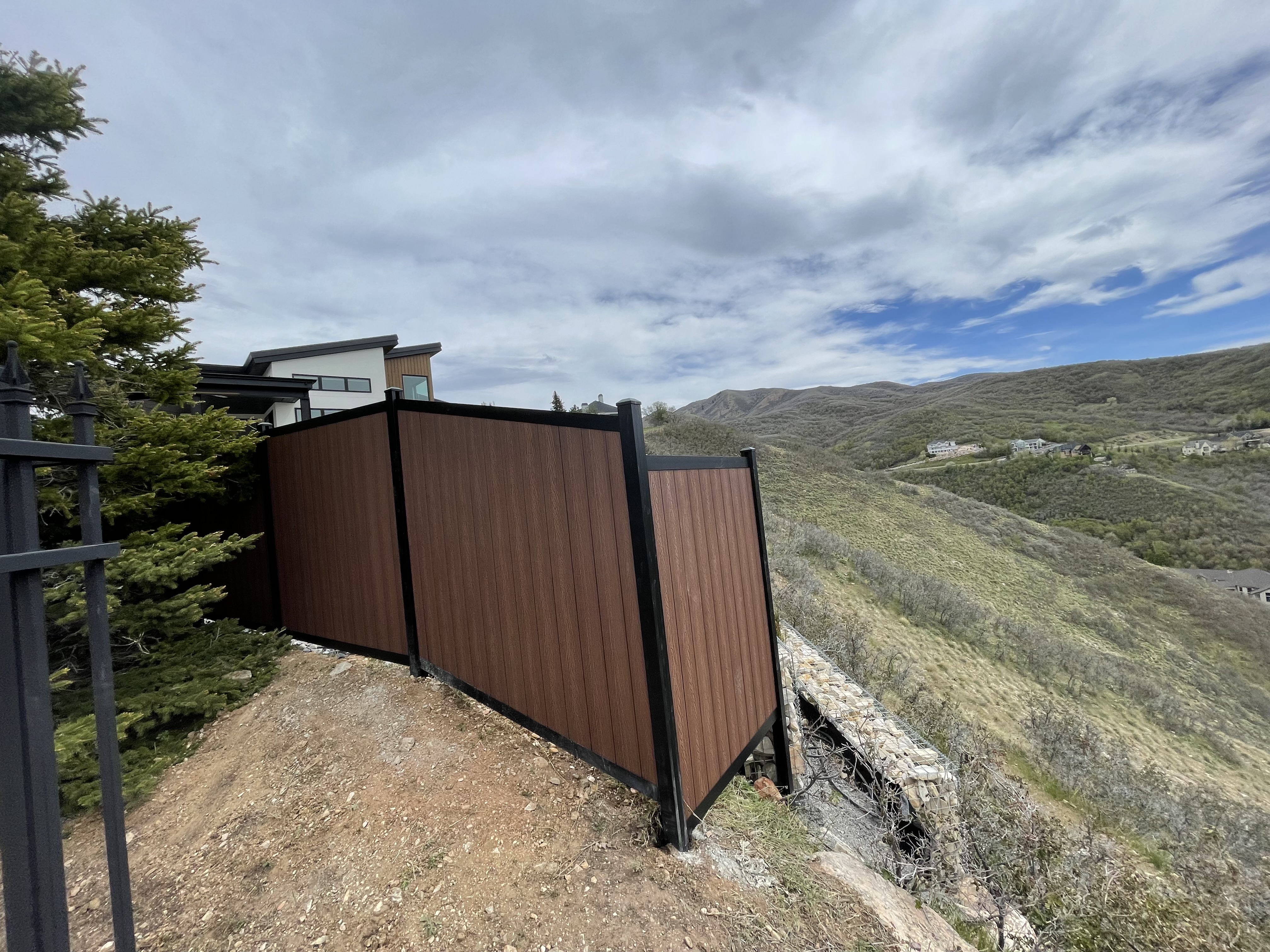 Black Avimore Aluminum with Composite Brown Wood Grain Fill installed by Spacemakers Fence in Bountiful, Utah